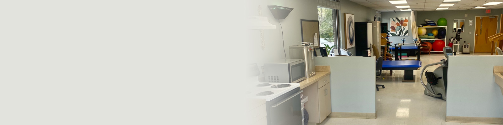 A kitchen next to the gym at Alta Heights