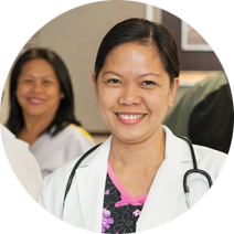Female doctor wearing white lab coat and a stethoscope draped over her shoulders